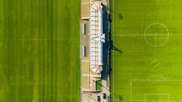 Soccer field with a large stadium in the background photo