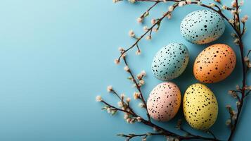 Blue background with four eggs on it, two of which are yellow and two are blue photo