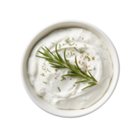 A top view of a white bowl filled with creamy dip garnished with rosemary and herbs on transparent background png