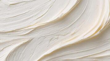 Creamy white moisturizer swirled perfectly in a container showcasing its smooth texture for skincare enthusiasts and beauty. Abstract background. photo