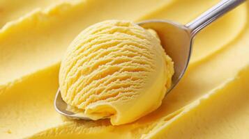 Creamy lemon ice cream scoop glistening under bright light with a shiny metal spoon resting on smooth yellow ice cream surface photo