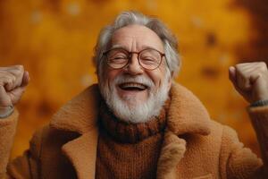 An older man with glasses and a beard is smiling photo