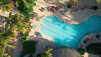 Aerial top view of resort swimming pool at sunset in Impressive Hotel Punta Cana video