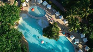 Aerial top view of a resort swimming pool at sunset in Impressive Punta Cana video