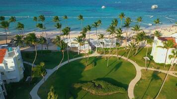 Aerial view of a tourist beach, the ocean, and a gated residence area video
