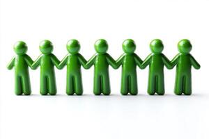 Green people standing in a line holding hands photo