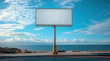 Blank billboard stands against a serene seaside backdrop at dusk, inviting creativity and inspiration from passersby photo
