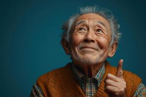 An old man pointing his finger up photo