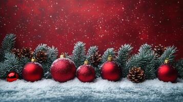 Festive arrangement of red ornaments and pine cones on a snowy surface against a vibrant background photo