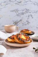 Baked bagels with tomato and quail egg on a plate on the table vertical view photo