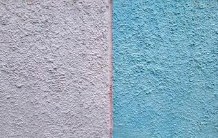 The background is white and blue made of rough decorative plaster photo