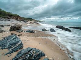 rugged beach with rocks waves and cloudy sky creating a dramatic seascape photo
