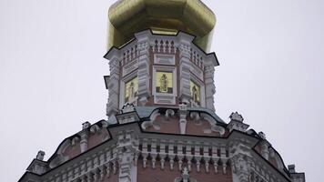 Golden cupola of the novodevichy convent reflecting light in moscow. Action photo