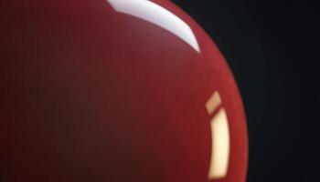 Red Sphere Close-Up Showing Reflective Light Against Dark Background photo