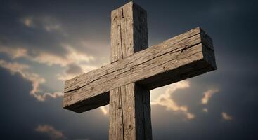 Looking up at Wooden Cross with Dramatic Sky Backdrop at Sunset photo