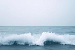 Gentle ocean waves crashing against the shore with a serene blue backdrop creating a calming atmosphere and evoking a sense of tranquility ocean waves concept photo