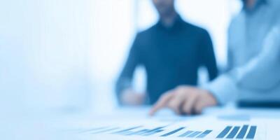 Business professionals analyzing financial data on a report with charts and graphs in a modern office environment, teamwork and collaboration concept photo