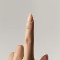 a person's finger is pointing up on a white background photo