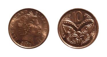 Ten Cents 2011, Coin from New Zealand, the coin shows the crowned bust of Queen Elizabeth II, facing right and a Maori carved head, It's made of Copper-plated steel, two sides of the coin. photo
