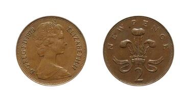 Two new pence 1979, Coin from United Kingdom, the coin shows the crowned bust of Queen Elizabeth II D G REG F D, facing right and the Badge of the Prince of Wales, It's made of Bronze photo