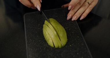 Slicing an Avocado for an Elegant Culinary Presentation That Impresses Diners and Guests video