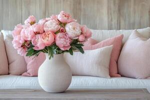 Soft pink peonies nestling in sleek vase, complementing minimalist living space with delicate floral sophistication photo