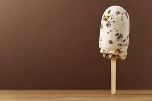 Vanilla ice cream with pieces of chocolate on a brown background creates a unique dessert atmosphere. photo