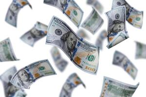Flying dollars banknotes isolated on a white background. Money is flying in the air. 100 US banknotes new sample. photo