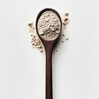 Wooden Spoon Filled with Crumbles on White Backdrop, Clean, Elegant Style photo