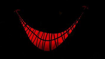 The red smiley face is on a black background video