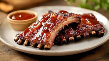 BBQ Ribs with Glazed Sauce Dripping on Right Side Plate and a Soft Focus Background for Branding photo