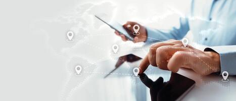 Businessman using tablet with map icons photo