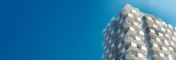 A tall building with a blue sky in the background photo