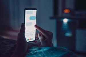 A person is using a smartphone with text messages on it photo