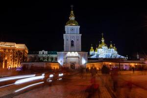 Night view from the Michael's Square to the St. Michael's Golden-Domed Monastery Complex, Kyiv, Ukraine. Motion blur lights photo