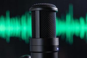Professional studio microphone with a green audio waveform in the background, close-up shot for sound recording theme photo