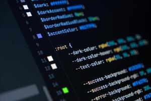 close-up of computer screen with colorful css code, focus on root selector, web development, frontend design and programming photo