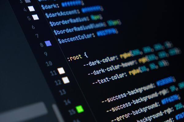 close-up of computer screen with colorful css code, focus on root selector, web development, frontend design and programming