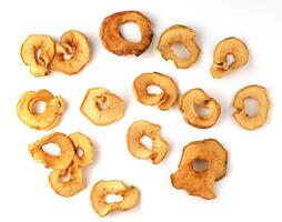 Dehydrated apple slices arranged artistically on a white background for healthy snacking options photo