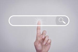 Search button on virtual screen pressed with finger on white background and shows the internet connection, international and global social media. Search concepts searched on the internet. photo