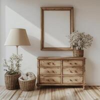 A wooden dresser and lamp in a room with a mirror photo