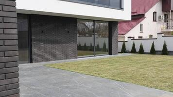 Modern house with large sliding glass door connecting indoor and outdoor video