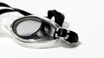 Black swimming goggles isolated on white background photo