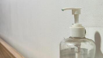 Hand sanitizer hanging on the wall photo