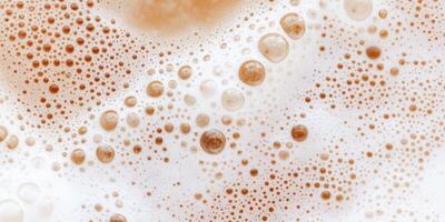 Close-up of intricate birch beer foam bubbles photo