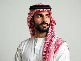 Portrait of Thoughtful Arab Man in Traditional Clothing Looking to Side photo