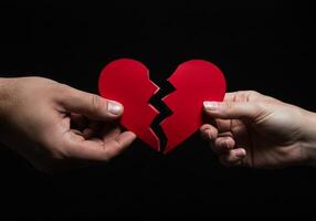 Holding Broken Heart Halves Representing Relationship Breakup and Emotional Pain photo
