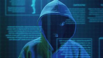 close-up cybercriminal hacker in a mask enters text on the keyboard video