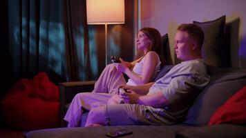 Couple Playing Game Sitting on the Couch video