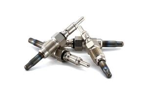 Close-Up of Glow Plugs for Diesel Engines Isolated on White Background photo